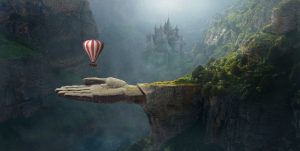fantasy hot ait balloon floating over a giant stone hand